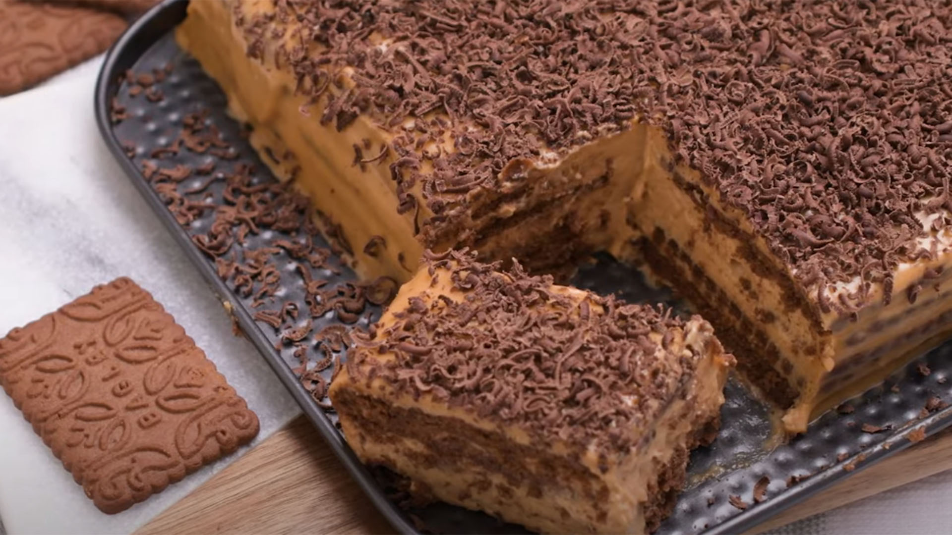 Traditional Argentine chocotorta made with Chocolinas cookies, dulce de leche, and cream cheese, topped with chocolate shavings. Traditional Argentine chocotorta made with Chocolinas cookies, dulce de leche, and cream cheese, topped with chocolate shavings.