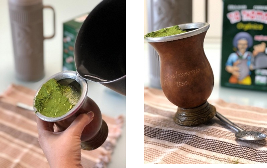 Preparing Brazilian chimarrão in a traditional cuia, showing fine green yerba mate and pouring hot water